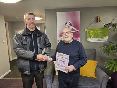 Cllr Michael Savage presenting Ron with his award